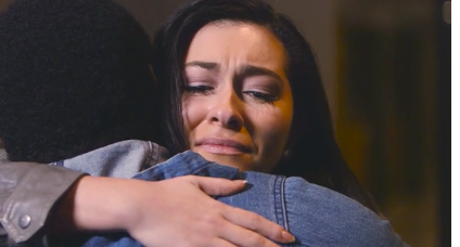 Woman hugging a man in a denim jacket