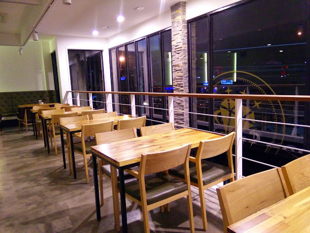 2nd flr, shot of tables near the glass wall