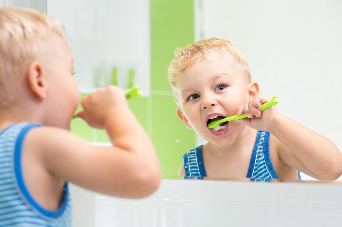 A picture containing person, brushing, teeth, indoor

Description automatically generated