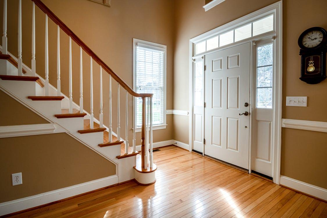 Free White Wooden Door on Brown Wooden Parquet Floor Stock Photo