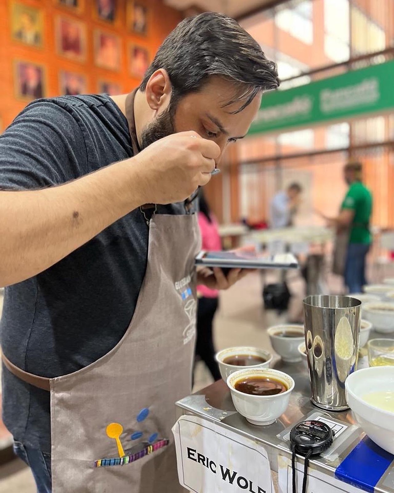 Little City Director of Coffee Eric Wolf cupping coffees at the Cup of Excellence Guatemala 2022