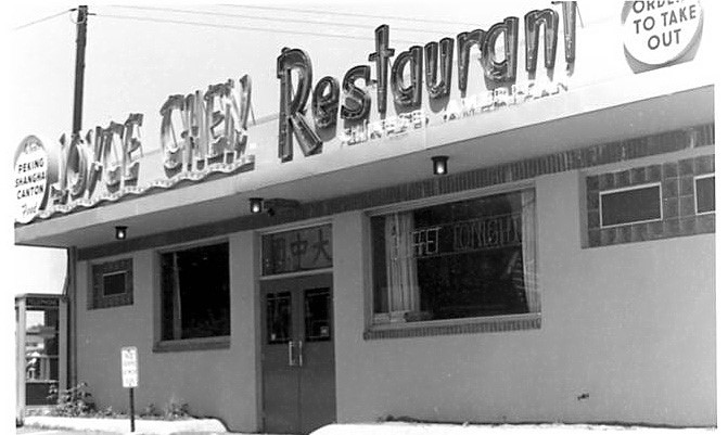 Street level view of one story building. Signage reads "Joyce Chen Restaurant"