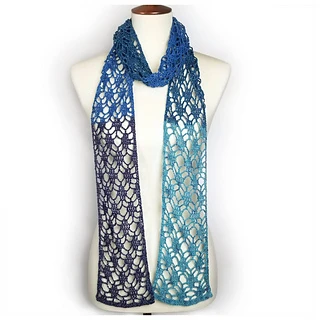 long lacy crochet scarf on dress form