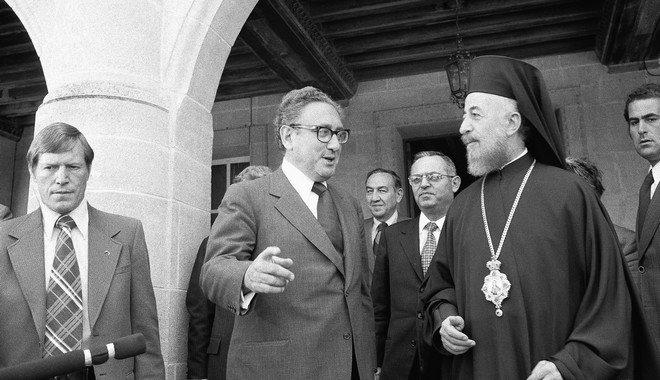 Secretary of State Henry A. Kissinger gesture as he talks with Archbishop Makarios, President of Cyprus, prior to meeting with Soviet Foreign Minister Andrei Gromyko in Nicosia on Tuesday, May 7, 1974. Second from left is Joseph Sisco, assistant Secretary of State. Other man is unidentified. (AP Photo)
