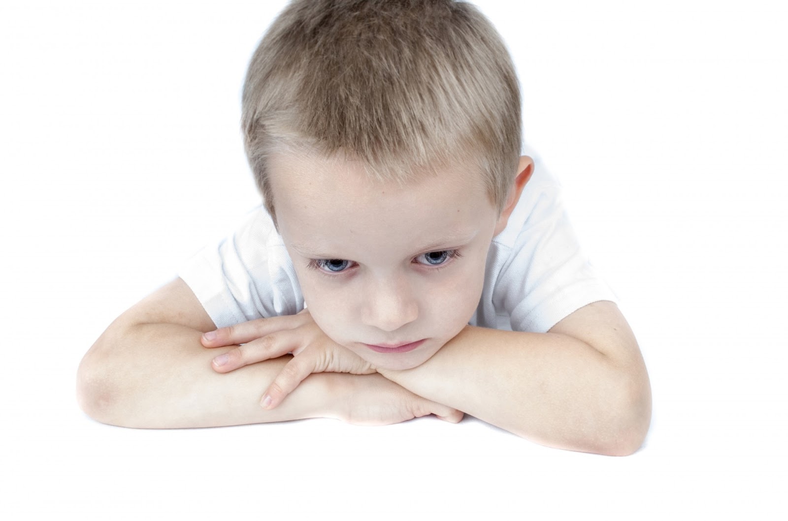 Sad little blonde boy
