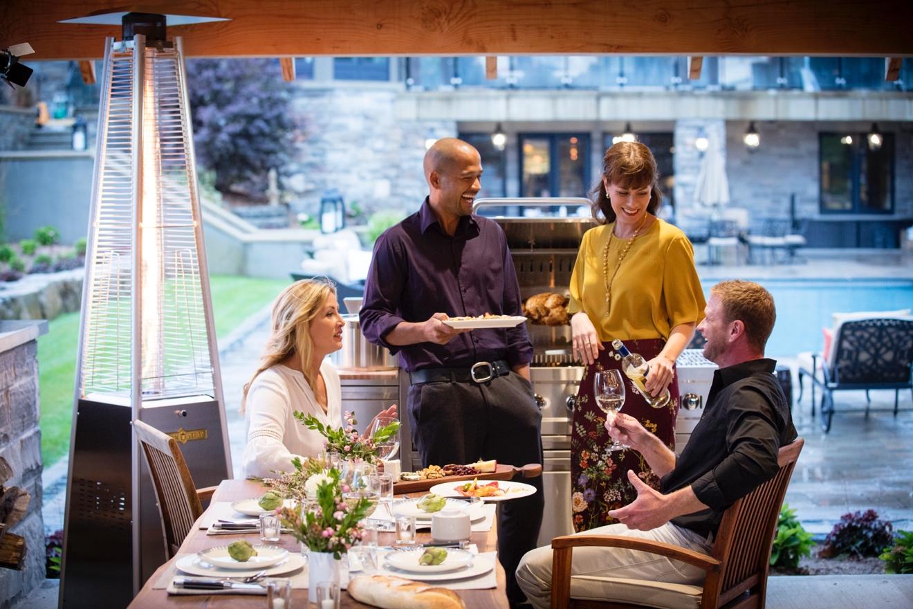 Two couples gather for outdoor BBQ dining 