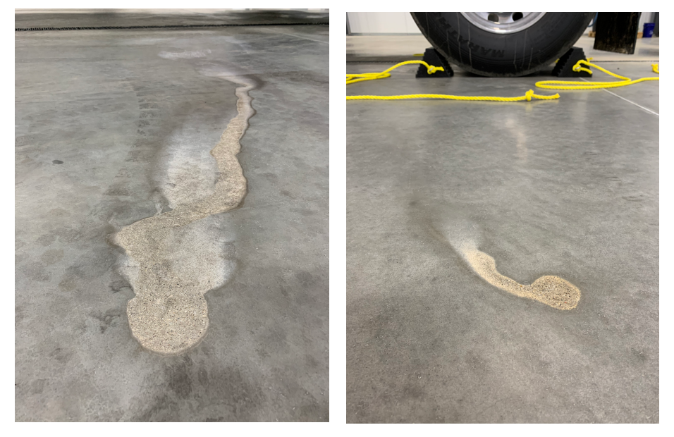 Concrete floor corrosion caused by exposure to acidic food substances in a food recycling facility.