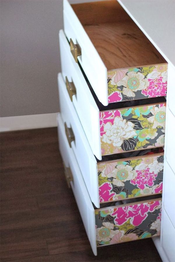 Wallpaper looks really effective used to pretty up the sides of drawers