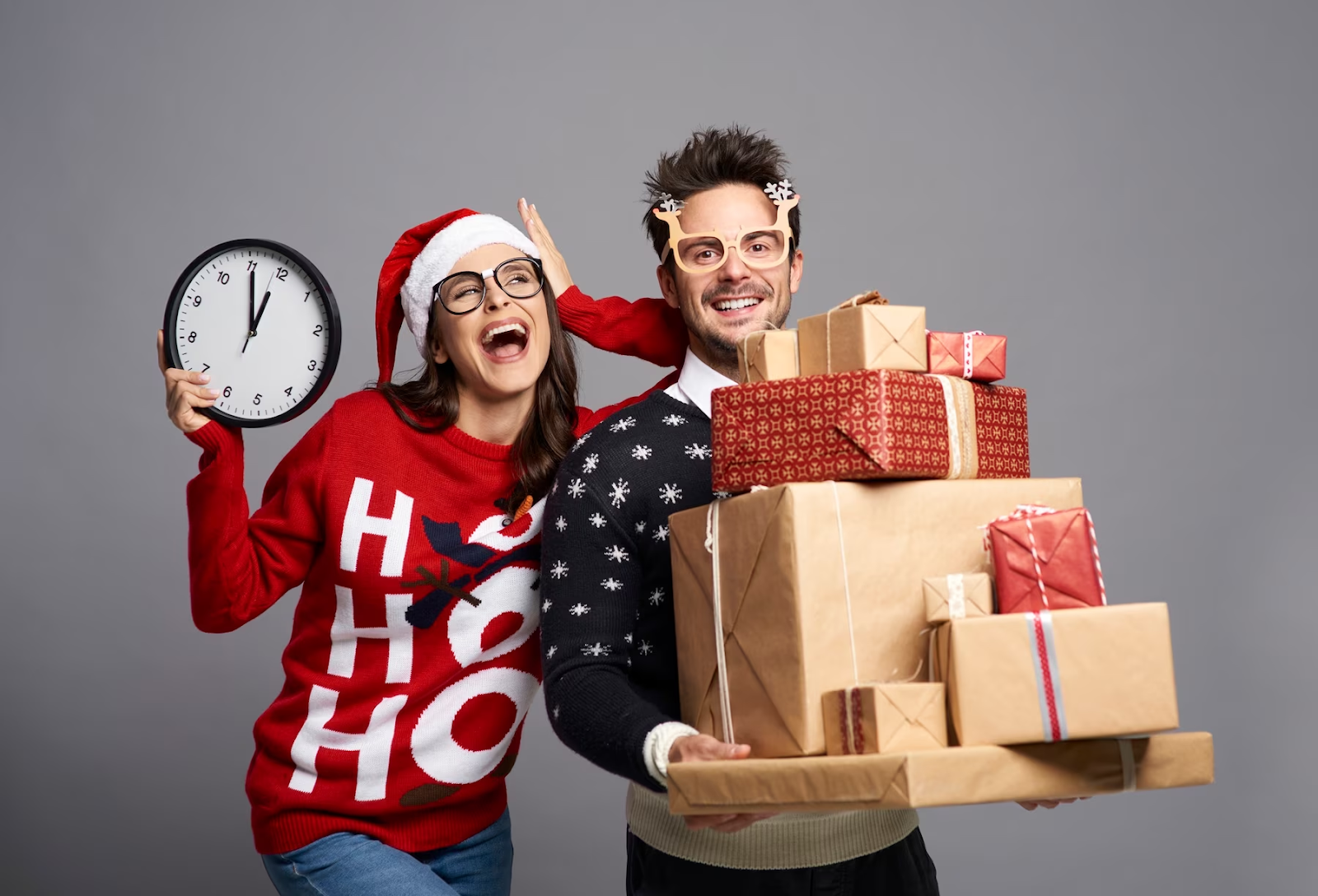 A couple with a bunch of gifts five minutes before New Year
