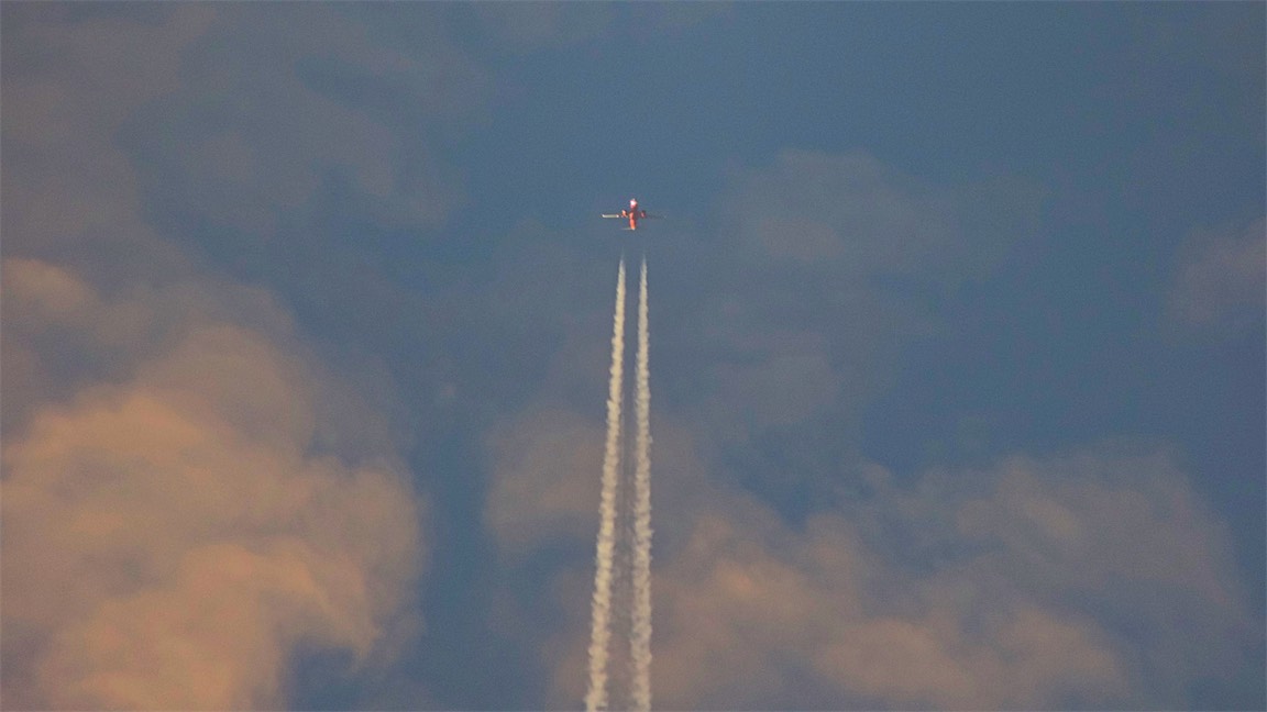 Plane In Sunset Sky.jpg