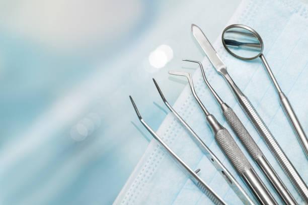 Set of metal Dentist's medical equipment tools Set of metal Dentist's medical equipment tools dental items stock pictures, royalty-free photos & images