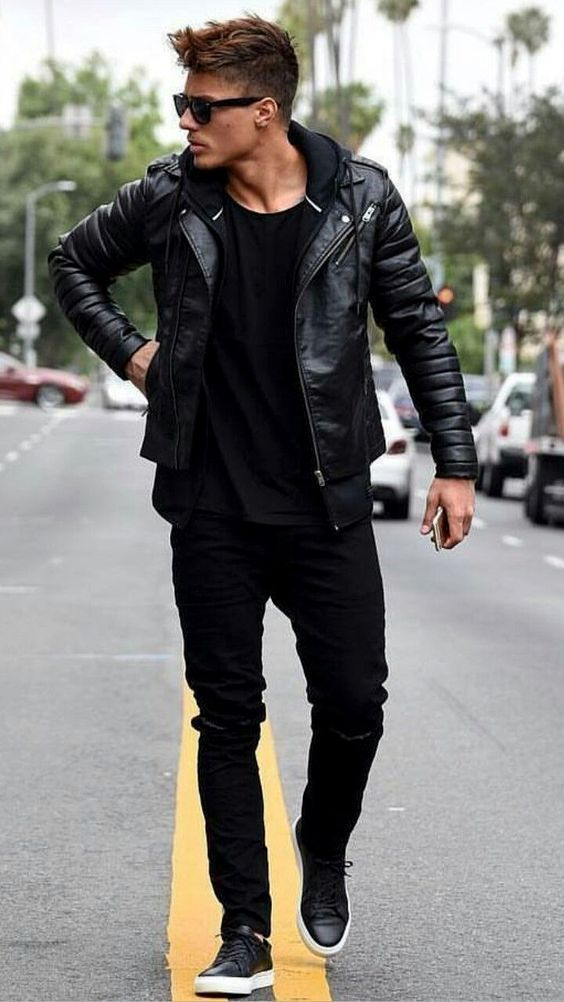 man wearing black leather jacket with black pants