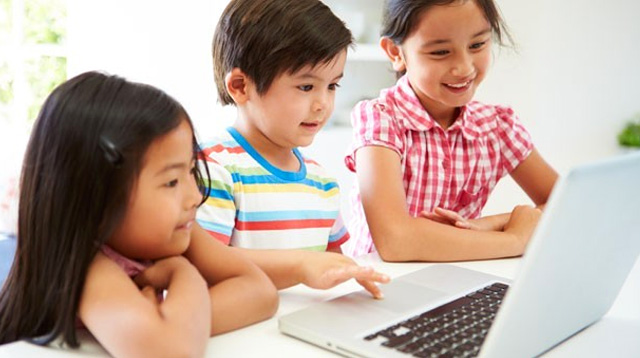 Learn Code Online - Three kids sitting browsing online