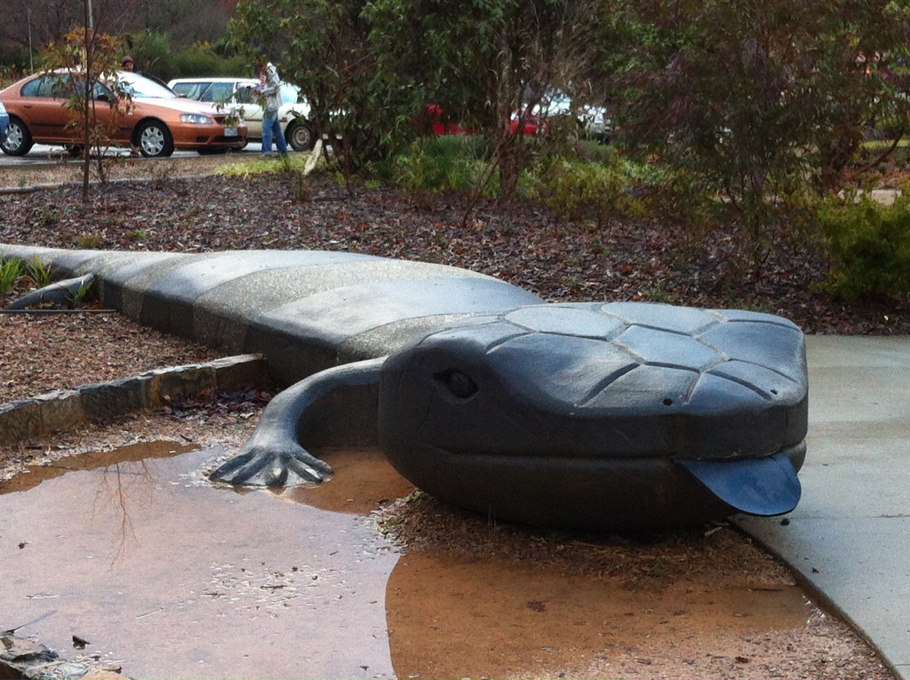 the big lizard sculpture with its tongue sticking out 