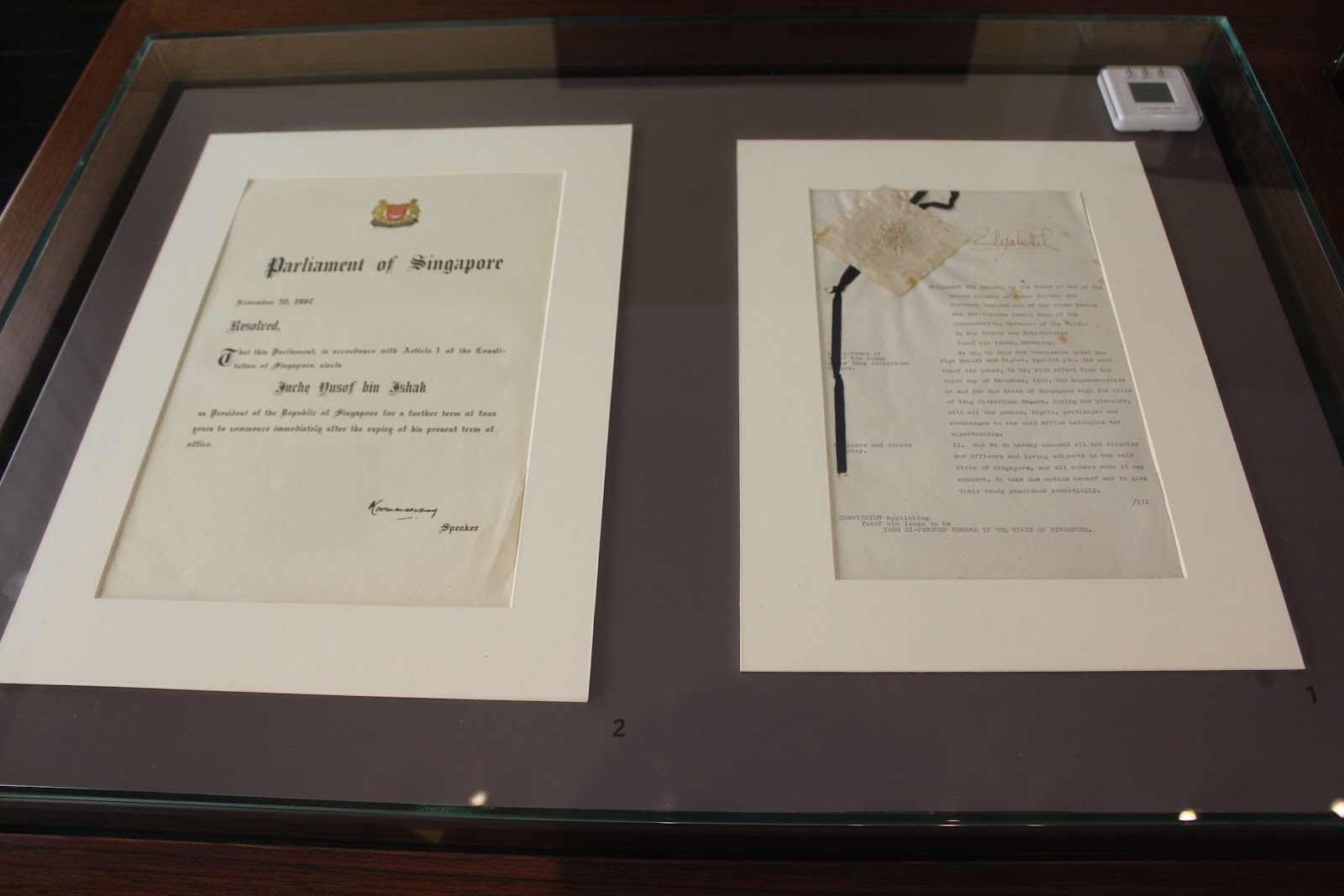 Signed documents signifying Singapore's independence and self-governance