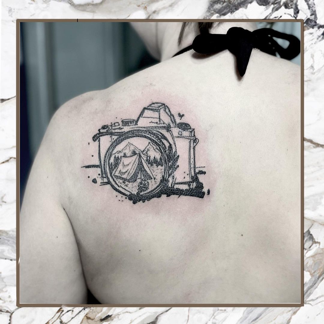 Grey Camera Tattoo On Back Shoulder