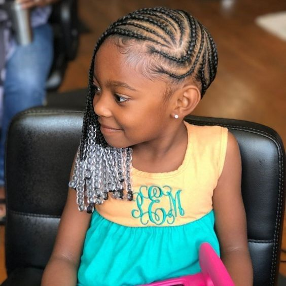 Beautiful baby girl sits like a queen rocking her kiddies braids hairstyle