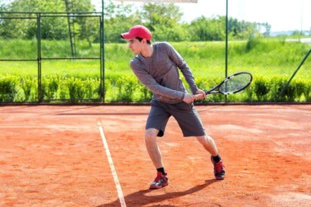 Tennis Player Hitting Backhand Shot