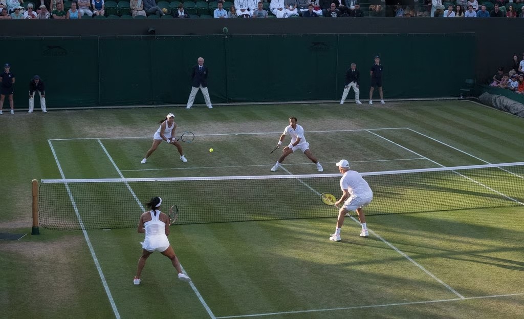 Latisha Chan and Ivan Dodig, top, playing Heather Watson and Henri Kontinen in mixed doubles at Wimbledon this week. | Credit: Duncan Grove for The New York