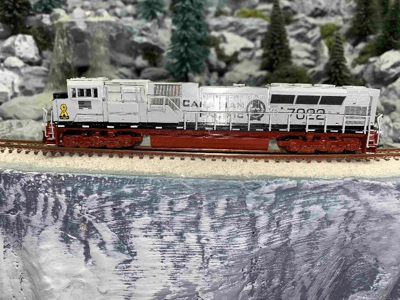 A picture containing N scale train, tree, outdoor - #7022 “Navy”