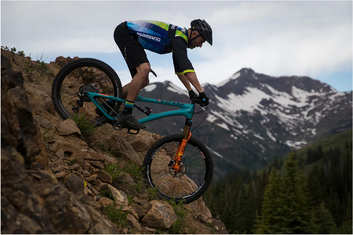 The extra width of a wide handlebar makes downhill mountain biking safer and easier. 