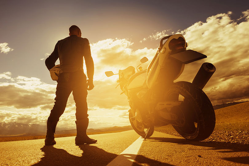 Bike riding into sunset