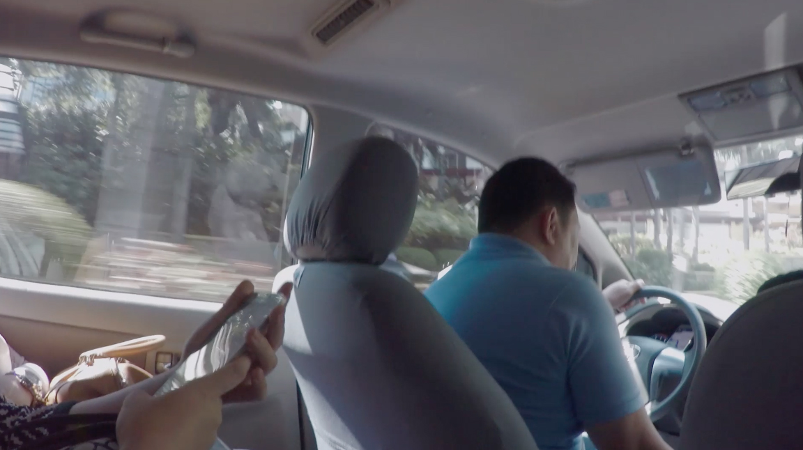 Inside an UberHop in Manila, Philippines. UberHop is a shared ride with other passengers, following predefined stops, similar to a public bus. Photo: Arthur Röing Baer