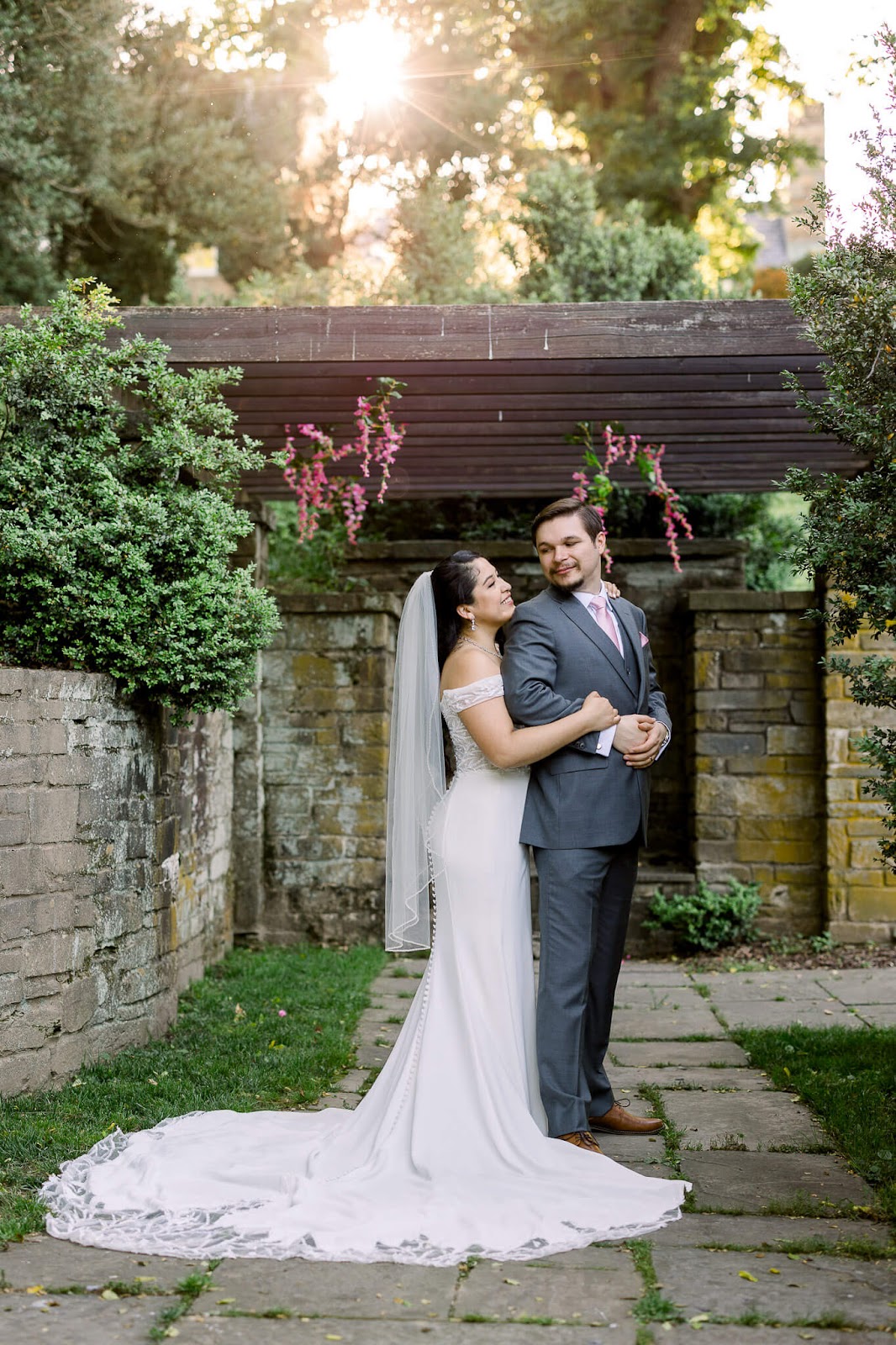 Bride holding groom sunset