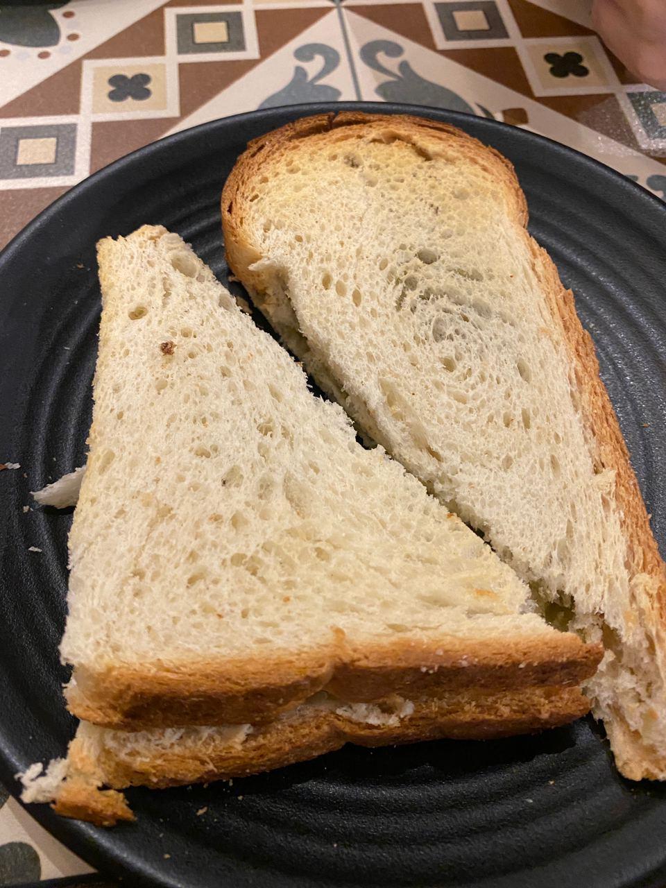 A loaf of bread on a plate

Description automatically generated