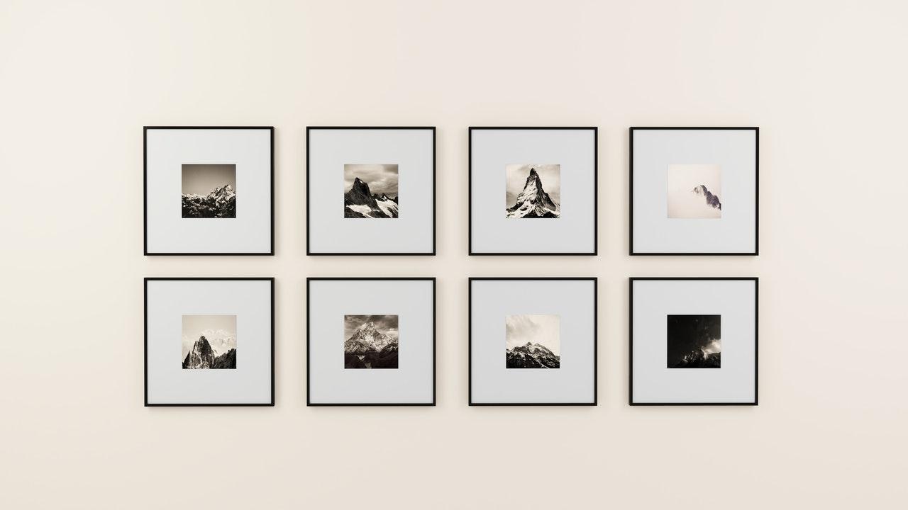 Framed greyscale photos of mountains