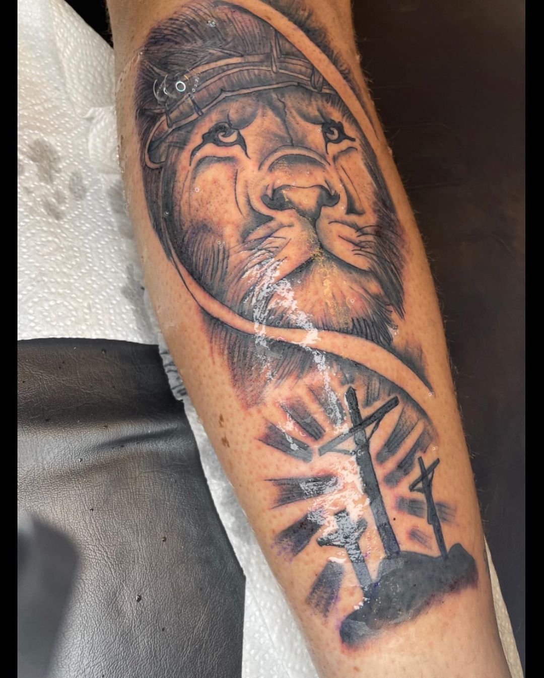 Lion And Three Cross Tattoo