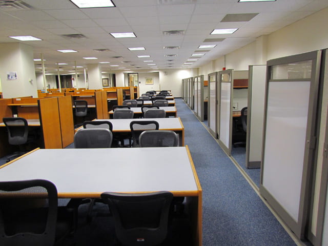 Picture of study carrels and open tables on Himmelfarb's 3rd floor. 