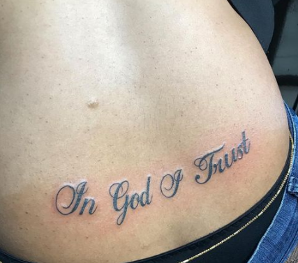 In God Of Trust Lower Back Tattoo