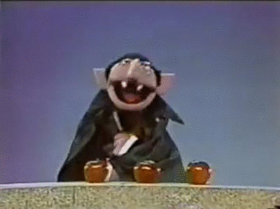 The Count from Sesame Street counting 3 apples.