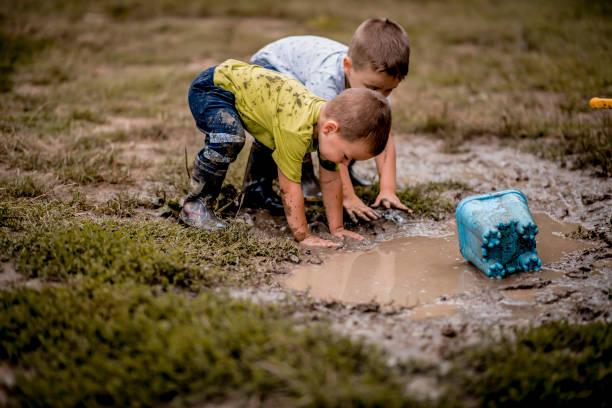 Mud Kids Stock Photos, Pictures & Royalty-Free Images - iStock