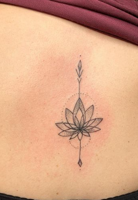 Lotus Flower On A Back Spine Tattoo