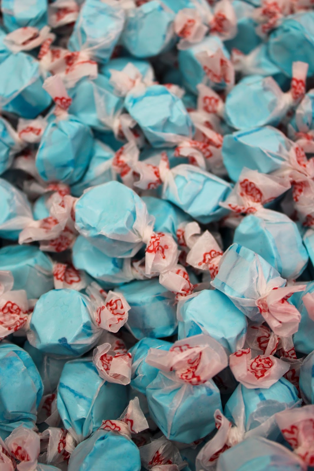 picture of blue mints in pink wrapping.
