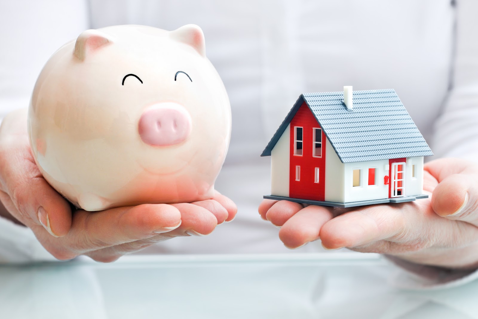 a toy home and a piggy bank for alternative mortgage financing options