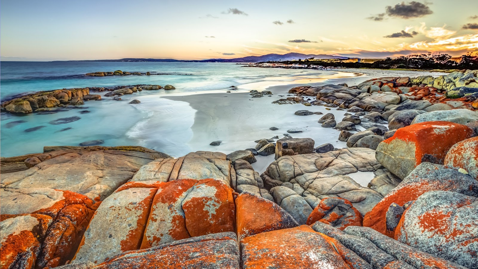 The orange-tinged boulders constrasted against the blue waters in the stunning Bay of Fires