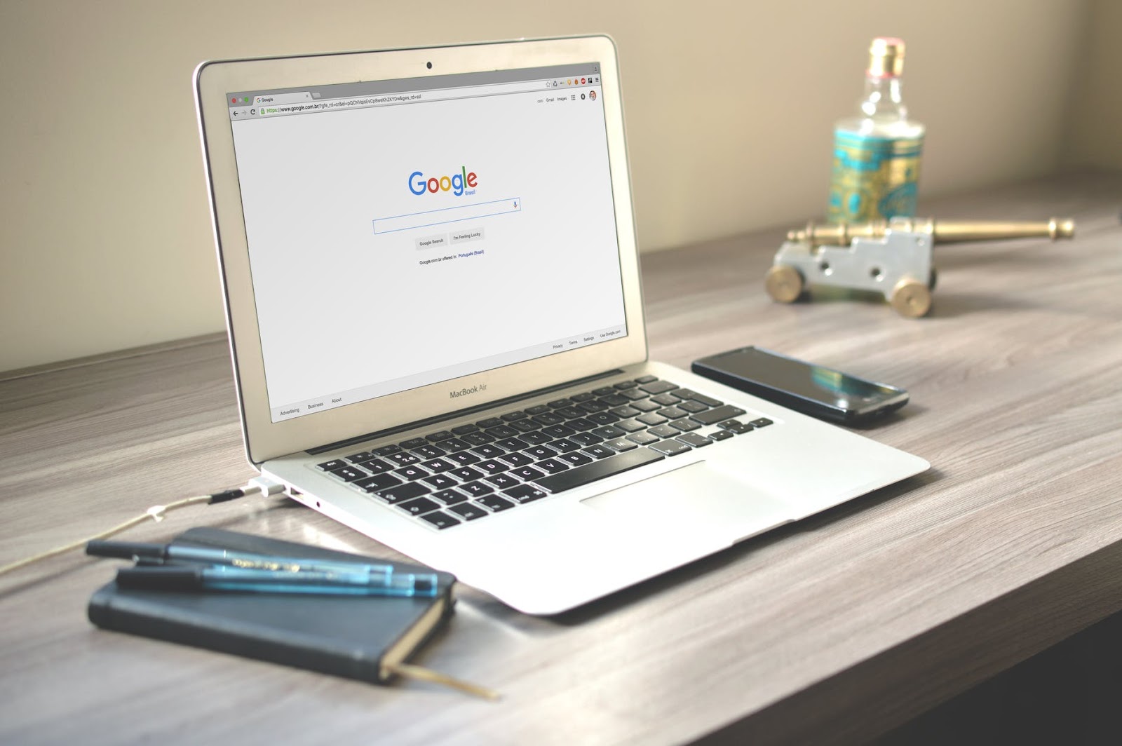 a silver laptop with google chrome  on the screen. 