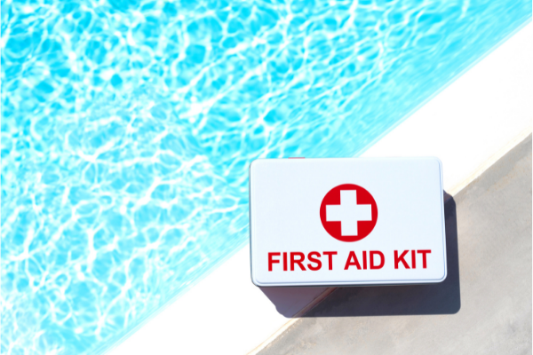 first aid kit next to a swimming pool