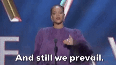 Rihanna is on stage at an awards ceremony saying with conviction "And still we prevail."