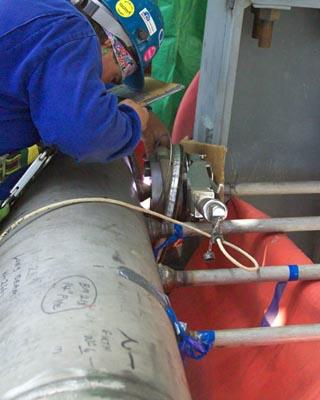 Orbital TIG welding is used to weld oil refinery piping.