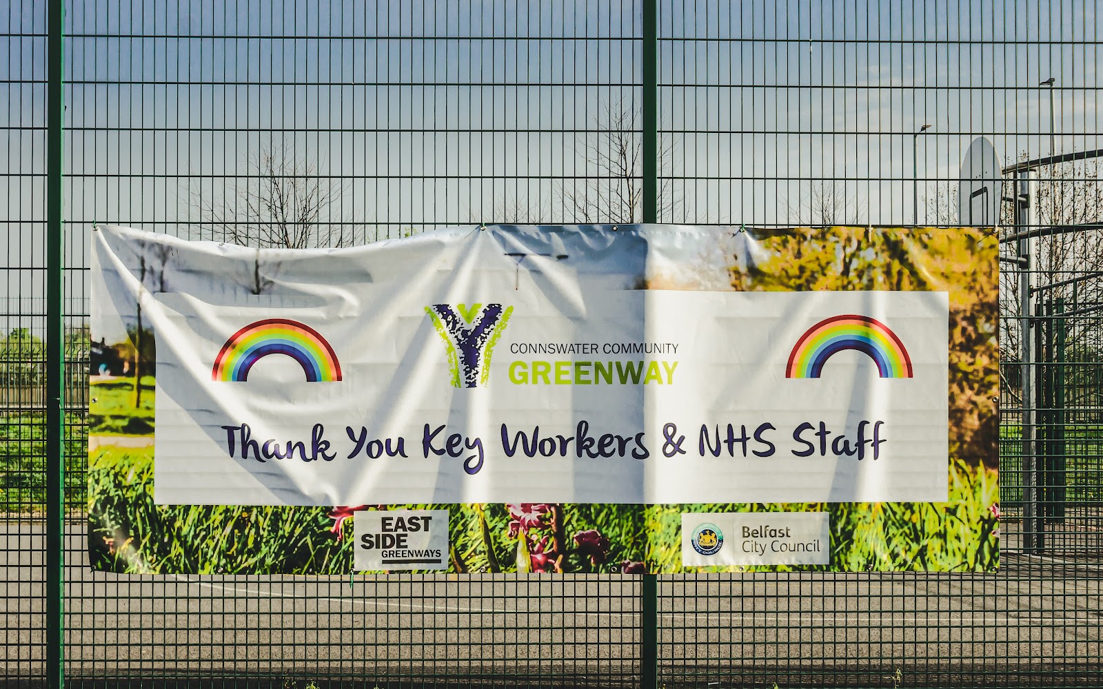 Banner hanging on a fence thanking key workers and staff