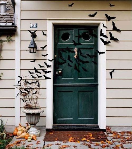 Halloween front door with bats flying across halloween decoration
