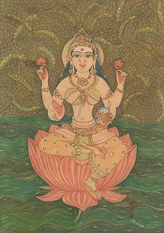 The goddess Annapurna sits cross-legged on a rust-colored lotus wearing an golden two-piece sari. 