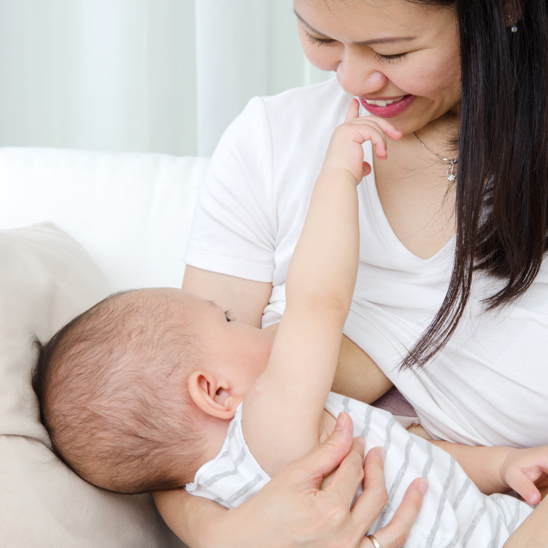 Asian mother breastfeeding her baby