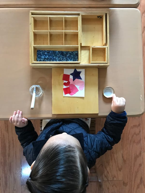a toddler working at a table