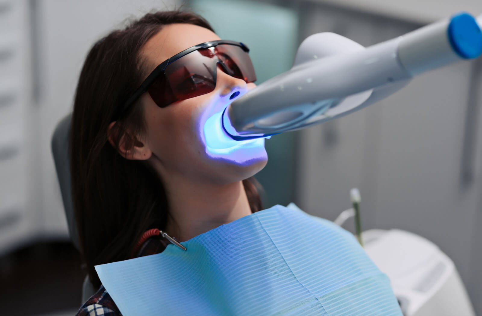 a woman has zoom whitening done at her dentist