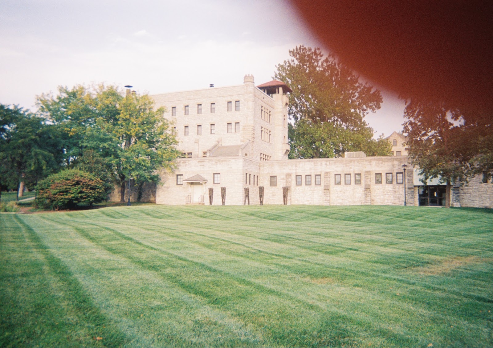 Image: Distance shot of friends on the campus of Lewis & Clark Community College. Courtesy of the author.